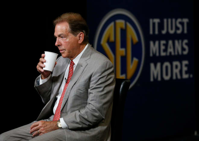 Alabama Head Coach Nick Saban sips coffee while waiting to for a TV interview to begin in the Hyatt Regency at SEC Media Days in Hoover, Ala., Photo | Gary Cosby Jr./Tuscaloosa News / USA TODAY NETWORK