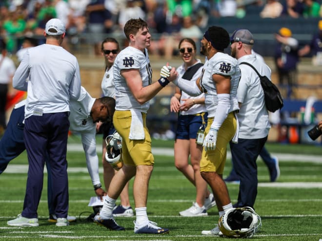 Quarterback Steve Angeli (left) and cornerback Jaden Mickey celebrate following Notre Dame's 2022 Blue-Gold Game.