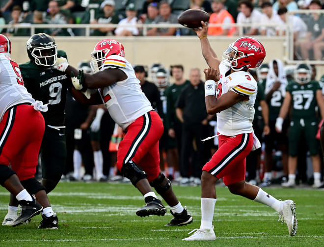 Taulia Tagovailoa (No. 3) threw for three touchdowns and ran for another in the Terps' win at Michigan State.