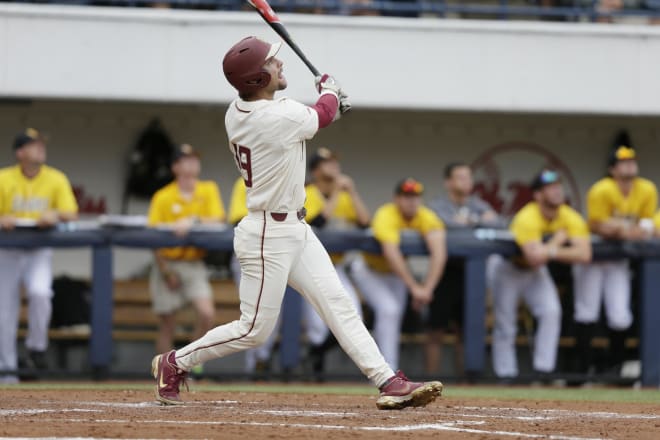 FSU's Elijah Cabell takes a big swing Sunday against Ole Miss.