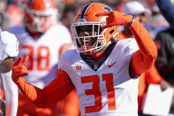 Illinois Fighting Illini defensive back Devon Witherspoon (31) celebrates a win against the Minnesota Golden Gophers in the fourth quarter at Huntington Bank Stadium.