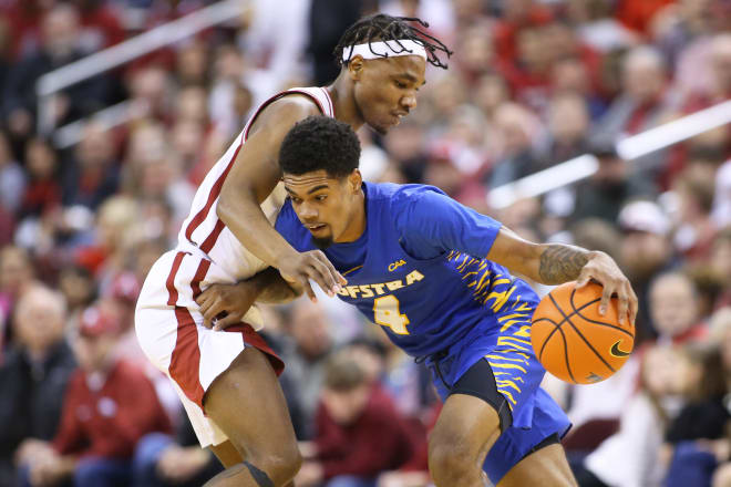 Hofstra Pride guard Aaron Estrada (4) drives against Arkansas Razorbacks guard JD Notae (1) during the first half at Simmons Bank Arena. Photo | Nelson Chenault-USA TODAY Sports
