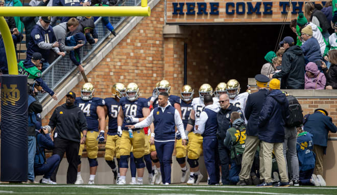 Notre Dame coach Marcus Freeman's quest to improve and evolve this offseason took him on the road to five NFL teams and to the Pacific Ocean aboard a Naval ship.