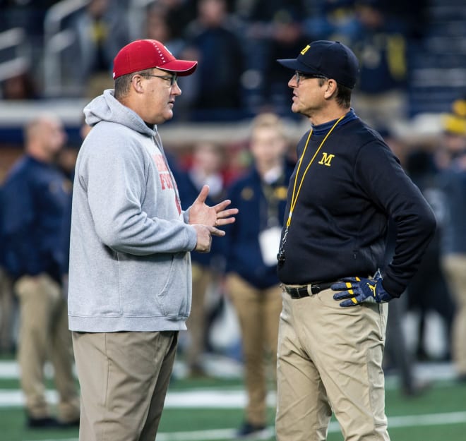 Wisconsin Badgers football head coach Paul Chryst and Michigan Wolverines football coach Jim Harbaugh