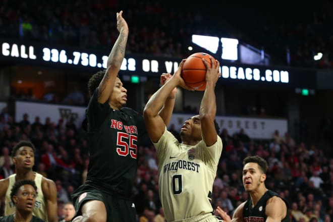 Wake Forest junior point Brandon Childress drives against NC State sophomore point guard Blake Harris during Tuesday's game in Winston-Salem, N.C. WFU won 71-67.
