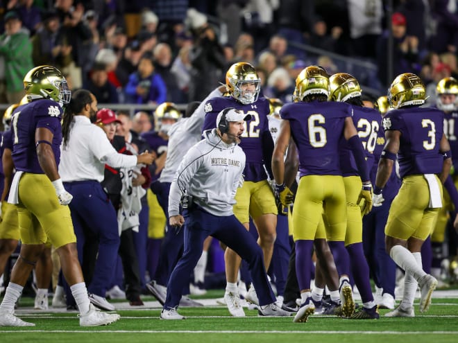 Brian Mason, middle, made an immediate impact as Notre Dame's special teams coordinator in 2022.