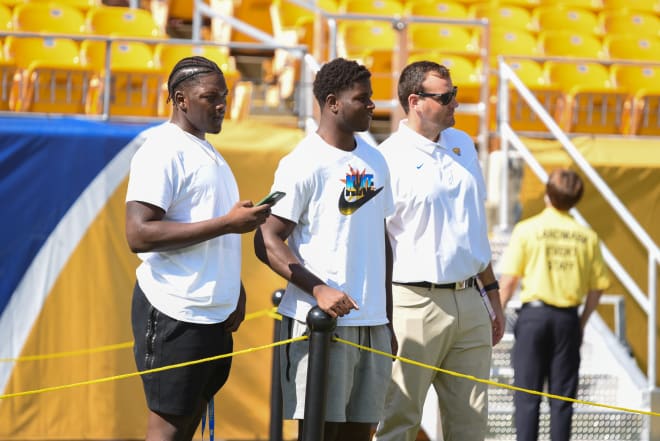 2023 OT Samson Okunlola, 2022 Pitt commit Samuel Okunlola and Pitt director of player personnel Graham Wilbert at Heinz Field last fall