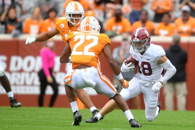 Alabama wide receiver Slade Bolden (18) runs the ball as Tennessee defensive back Jaylen McCollough (22) and Tennessee linebacker Henry To'o To'o (11) defend during a game between Alabama and Tennessee at Neyland Stadium in Knoxville, Tenn. on Saturday.