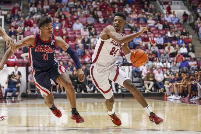 Alabama Crimson Tide forward Brandon Miller (24) drives to the basket against Mississippi Rebels guard Matthew Murrell (11) during the second half at Coleman Coliseum. Photo | Marvin Gentry-USA TODAY Sports