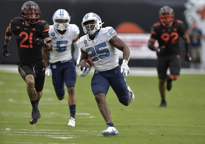 Javonte Williams ran for 236 yards Saturday and set a single-season UNC scoring record. 