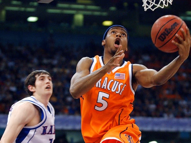 Syracuse's Josh Pace puts up a shot in front of Kansas' Kirk Hinrich in the second half of the championship game at the Final Four Monday, April 7, 2003, in New Orleans. (AP Photo/Al Behrman)