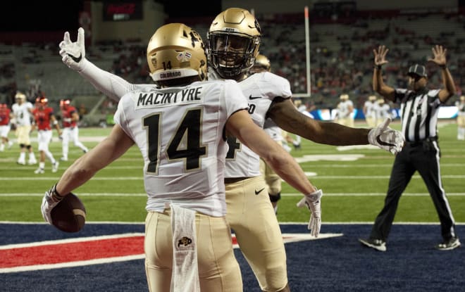 Nov 12, 2016; Tucson, AZ, USA; Colorado Buffaloes wide receiver Jay MacIntyre (14) and wide receiver Bryce Bobo (4) celebrate after scoring a touchdown against the Arizona Wildcats during the second quarter at Arizona Stadium. Mandatory Credit: Casey Sapio-USA TODAY Sports
