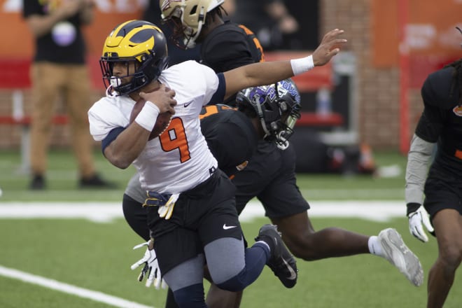 Former Michigan Wolverines running back Chris Evans showed his versatility on day one of the Senior Bowl practices.