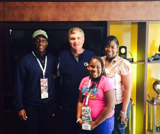 Jackson with Jackets head coach Paul Johnson and his mother and little sister during their visit on June 14th
