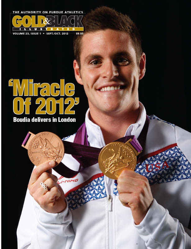 David Boudia showing off his Gold and Bronze medals earned at the 2012 Olympics.