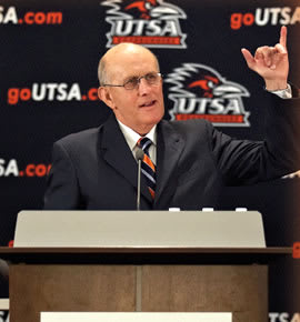 Larry Coker gives a "Birds Up" after being introduced as the first head football coach in UTSA history.