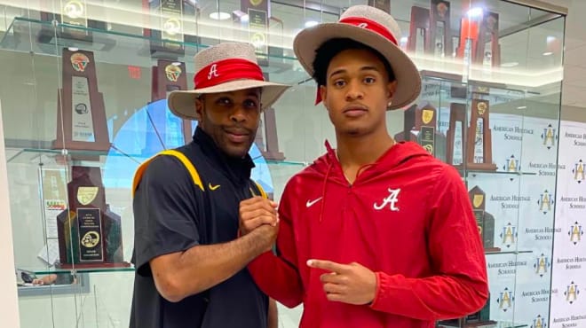 Earl Little Jr., (right) with his father, Earl Sr.,  after his announcement for the Crimson Tide.