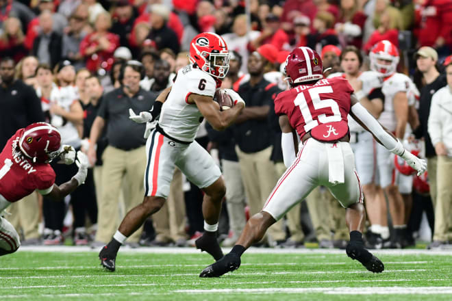 Kenny McIntosh carries the ball against Alabama in the national championship. (Perry McIntyre/UGA Sports Communications)