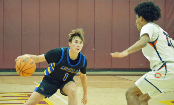 Ethan Klopp (Agoura) is defended by Kamden Edwards (Chaminade).