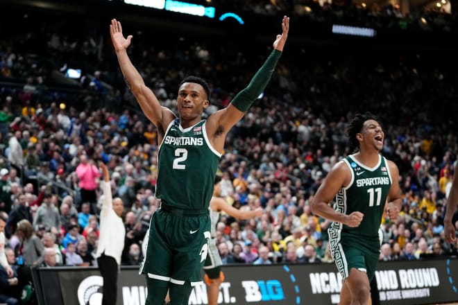 Mar 19, 2023; Columbus, Ohio, USA; Michigan State Spartans guard Tyson Walker (2) and guard A.J. Hoggard (11) celebrate their 69-60 win over the Marquette Golden Eagles during the second round of the NCAA men's basketball tournament at Nationwide Arena. Photo Credit: Adam Cairns-The Columbus Dispatch