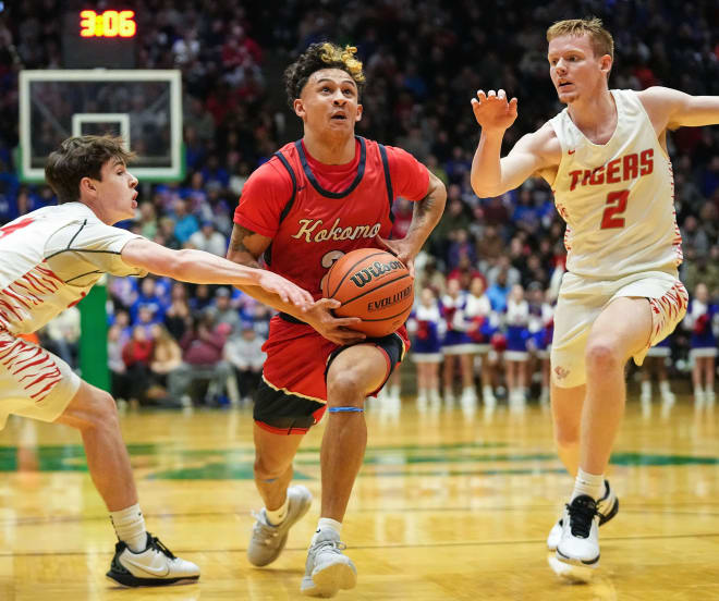 Kokomo Wildkats guard Reis Beard (2) rushes up the court against Fishers Tigers Cooper Zachary (4) on Saturday, March 9, 2024, during the IHSAA boys basketball regional final at the New Castle Fieldhouse in New Castle. The Fishers Tigers defeated the Kokomo Wildkats, 66-52.