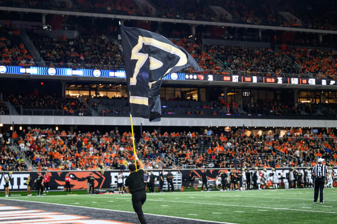 Sep 21, 2024; Corvallis, Oregon, USA; Purdue Boilermakers cheerleader waves the flag after a touchdown against the Oregon State Beavers during the second half at Reser Stadium. Mandatory Credit: Craig Strobeck-Imagn Images