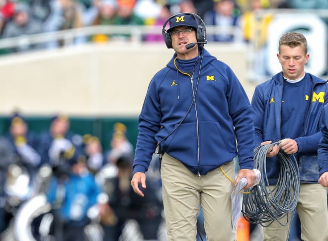 Michigan head coach Jim Harbaugh was 2-1 in rivalry games this year. 