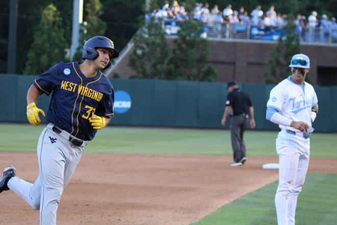 Kyle West runs the bases after hitting a home run against North Carolina
