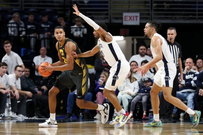 Kris Murray battles Camren Wynter in Iowa's 83-79 loss to Penn State. 