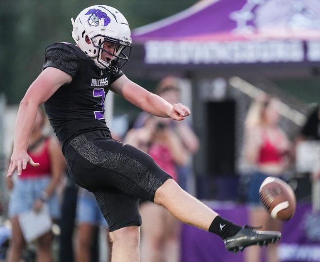 Brownsburg Bulldogs Spencer Porath (3) kicks the ball Friday, Aug. 25, 2023, during the game at Brownsburg High School in Brownsburg. The Brownsburg Bulldogs defeated the Cathedral Fighting Irish, 45-31.