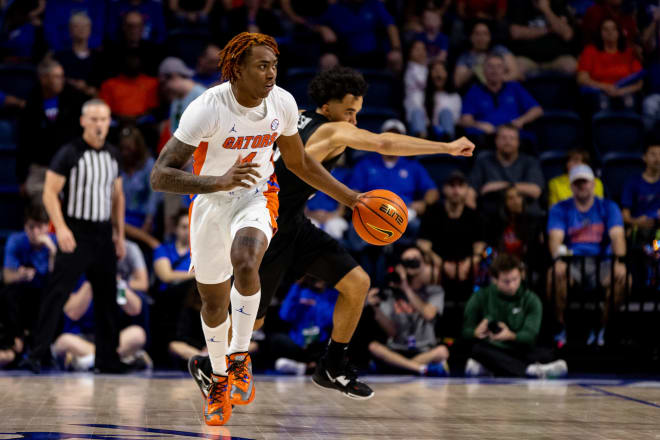 Florida Gators guard Niels Lane (4) dribbles the ball during the second half against the Stetson Hatters at Exactech Arena at the Stephen C. O'Connell Center. Photo | Matt Pendleton-USA TODAY Sports