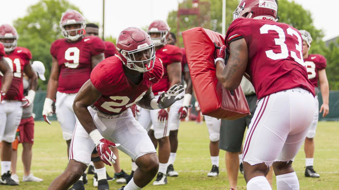Terrell Hall (left) goes through a drill on Wednesday | Photo by Laura Chramer 
