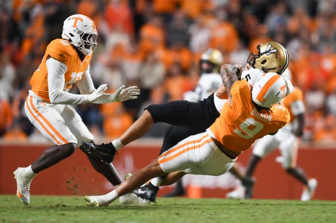 Tennessee defensive lineman Tyler Baron (9) sacks Vanderbilt quarterback AJ Swann (5) during a football game between Tennessee and Vanderbilt at Neyland Stadium in Knoxville, Tenn., on Saturday, Nov. 25, 2023.