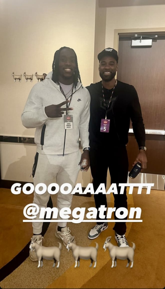 Robinson poses with Johnson a couple days before the draft.
