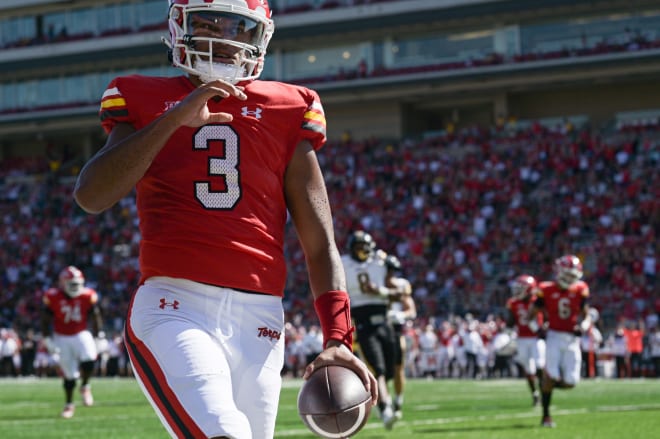 Taulia Tagovailoa (No. 3) celebrates after scoring a first-quarter touchdown. 