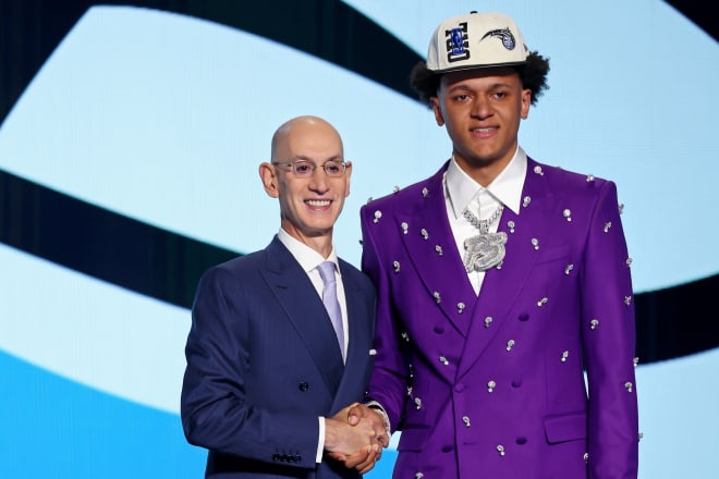 Paolo Banchero, right, poses with NBA commissioner Adam Silver after being the No. 1 overall pick. 