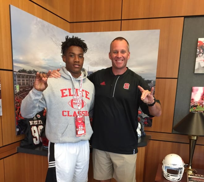 Williamson poses for a picture with NCSU head coach Dave Doeren.