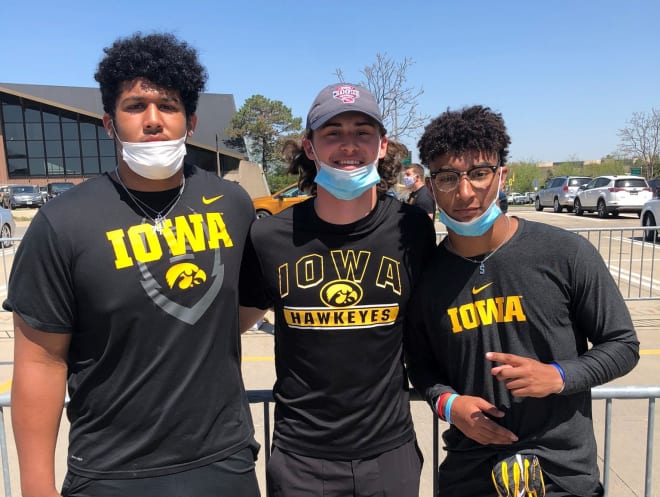 Kadyn Proctor, left, with Iowa commit Brody Brecht, center, and Xavier Nwankpa, right.