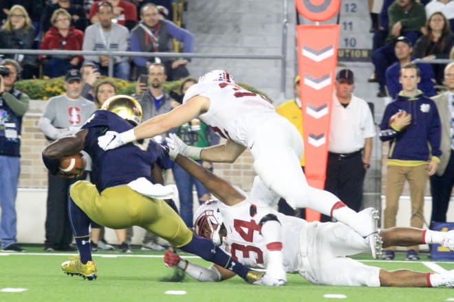 Malik Zaire goes down against Stanford.