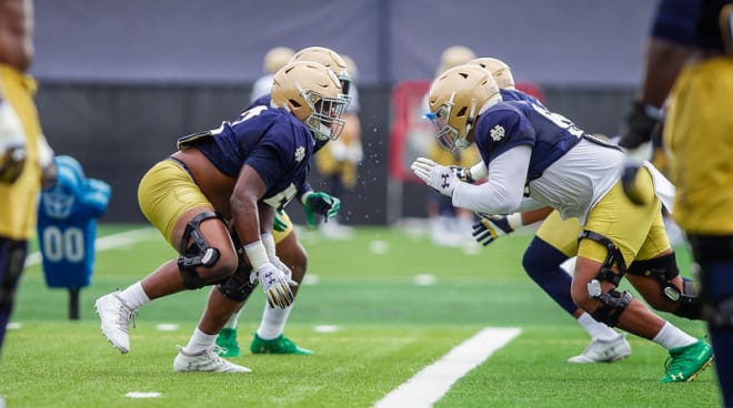 Notre Dame Fighting Irish football players at practice