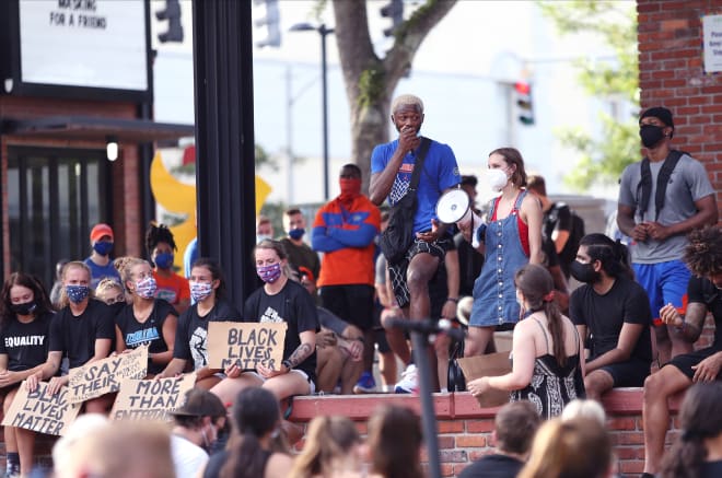 Florida's Scottie Lewis (middle) addresses protestors last Friday. 