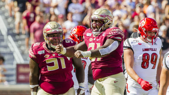 FSU defensive tackle Marvin Wilson (right) is at the center of attention for Georgia Tech's offense.