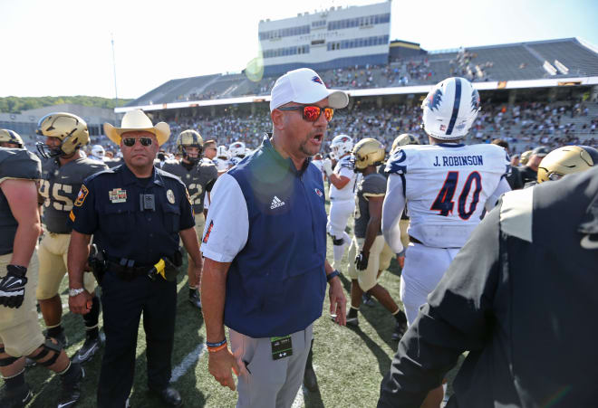 I get that we must protect our football coaches at all costs, but I don't know, it kind of seems like having the armed Texas Highway Patrol officer scanning the crowd AT FREAKING WEST POINT to protect UTSA coach Jeff Traylor might be a bit much. 