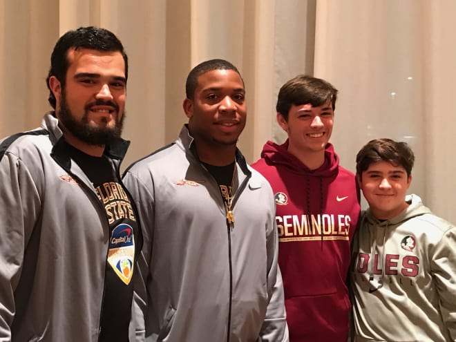 FSU football players Corey Martinez and DeMarcus Walker spend time with Bradley Jr. and Brenden Deanda.