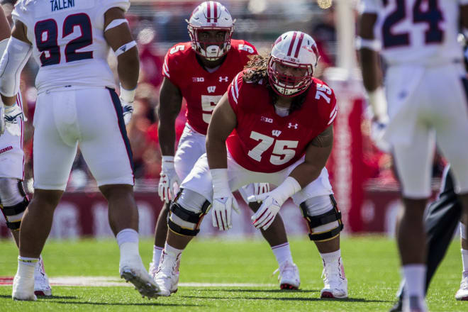 Micah Kapoi (75) is first in line to start at guard if the Badgers need him - but who else is ready?