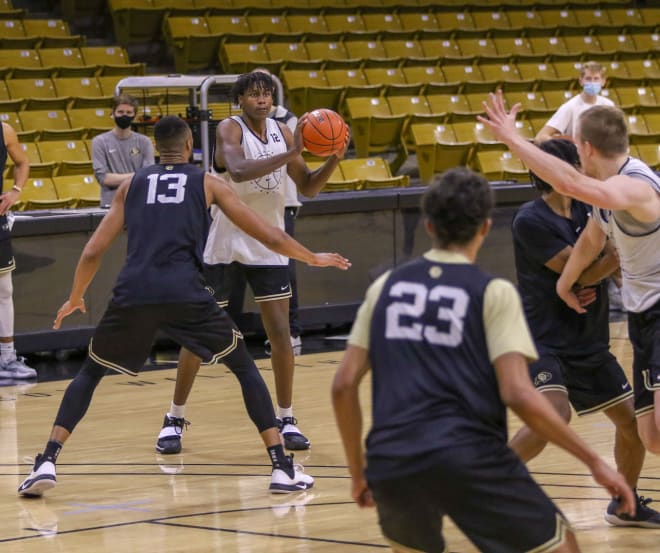 Jabari Walker is defended by senior center Dallas Walton (13) in practice 