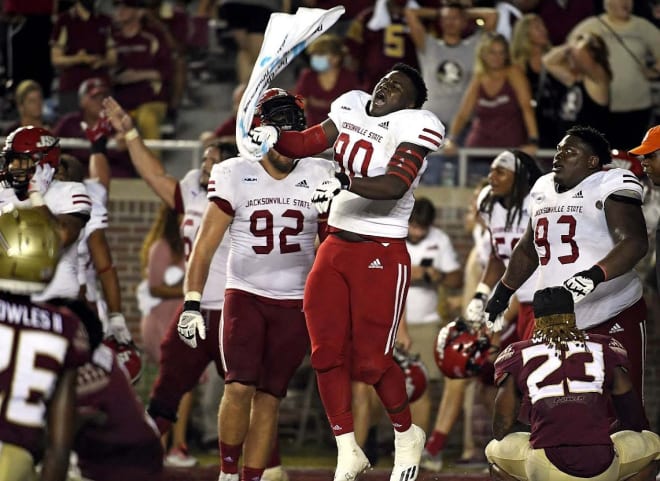 Jacksonville State players celebrate after knocking off Florida State, 20-17, with a last-second touchdown.