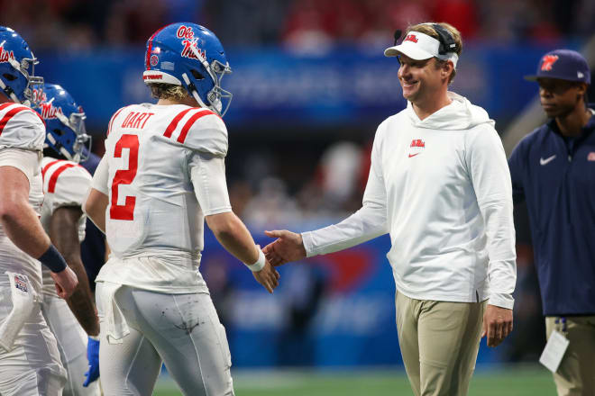 Ole Miss Rebels head coach Lane Kiffin celebrates with quarterback Jaxson Dart (2) after a touchdown against the Penn State Nittany Lions in the second half at Mercedes-Benz Stadium. Mandatory Credit: Brett Davis-USA TODAY Sports