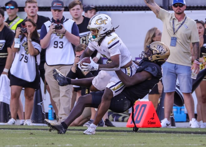 McCollum gets tackled by a UCF defender