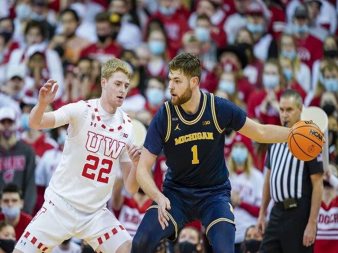 Wisconsin's Steven Crowl defends Michigan's Hunter Dickinson. In 27 minutes on the floor, Crowl was whistled for only one foul.